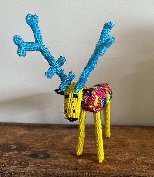 Celebrate the festive season with a touch of whimsy through the vibrant artistry of Monkeybiz’s handcrafted Beaded Reindeer.